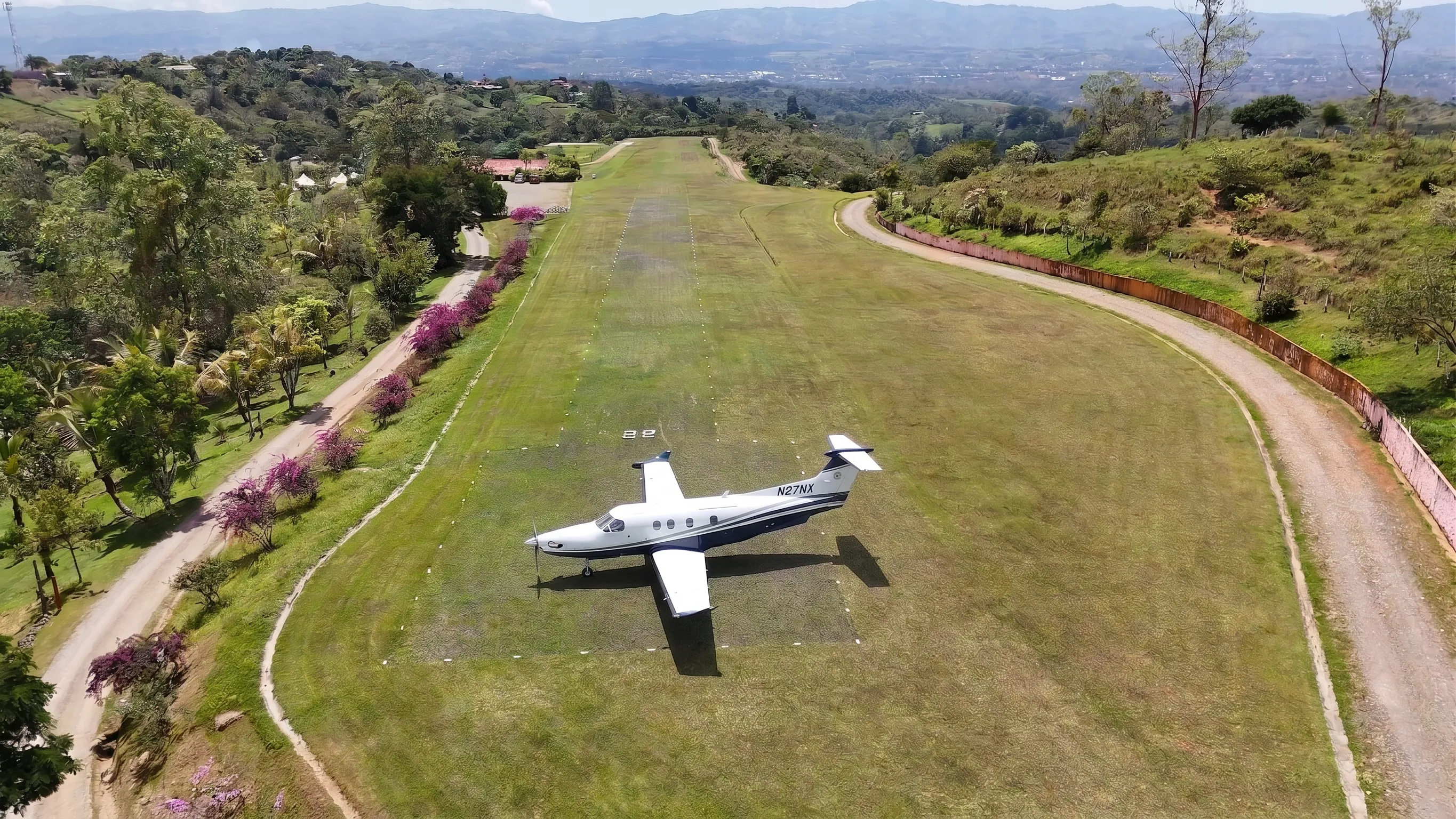 Private airstrip at RISE Costa Rica with plane on grass runway