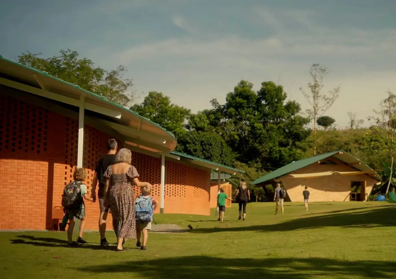 Families walking children to school at RISE Costa Rica campus